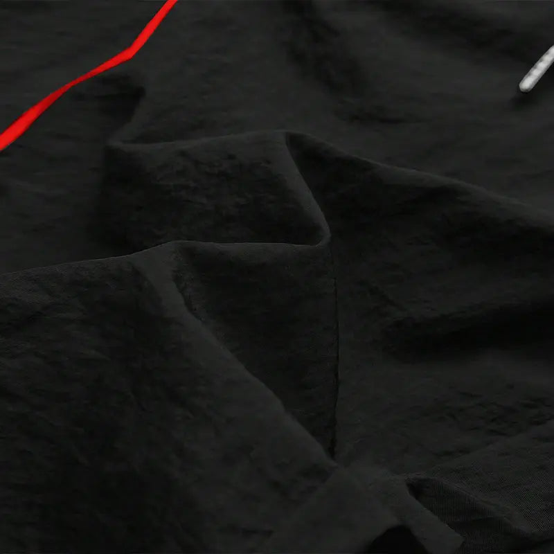 Men’s summer black-and-red quick-dry wide-leg pants with side stripes and a drawstring waist; breathable fabric with a slight wrinkle texture, loose straight cut, side stripe detailing, adjustable cuffs at the leg openings. Suitable for jogging, fitness,